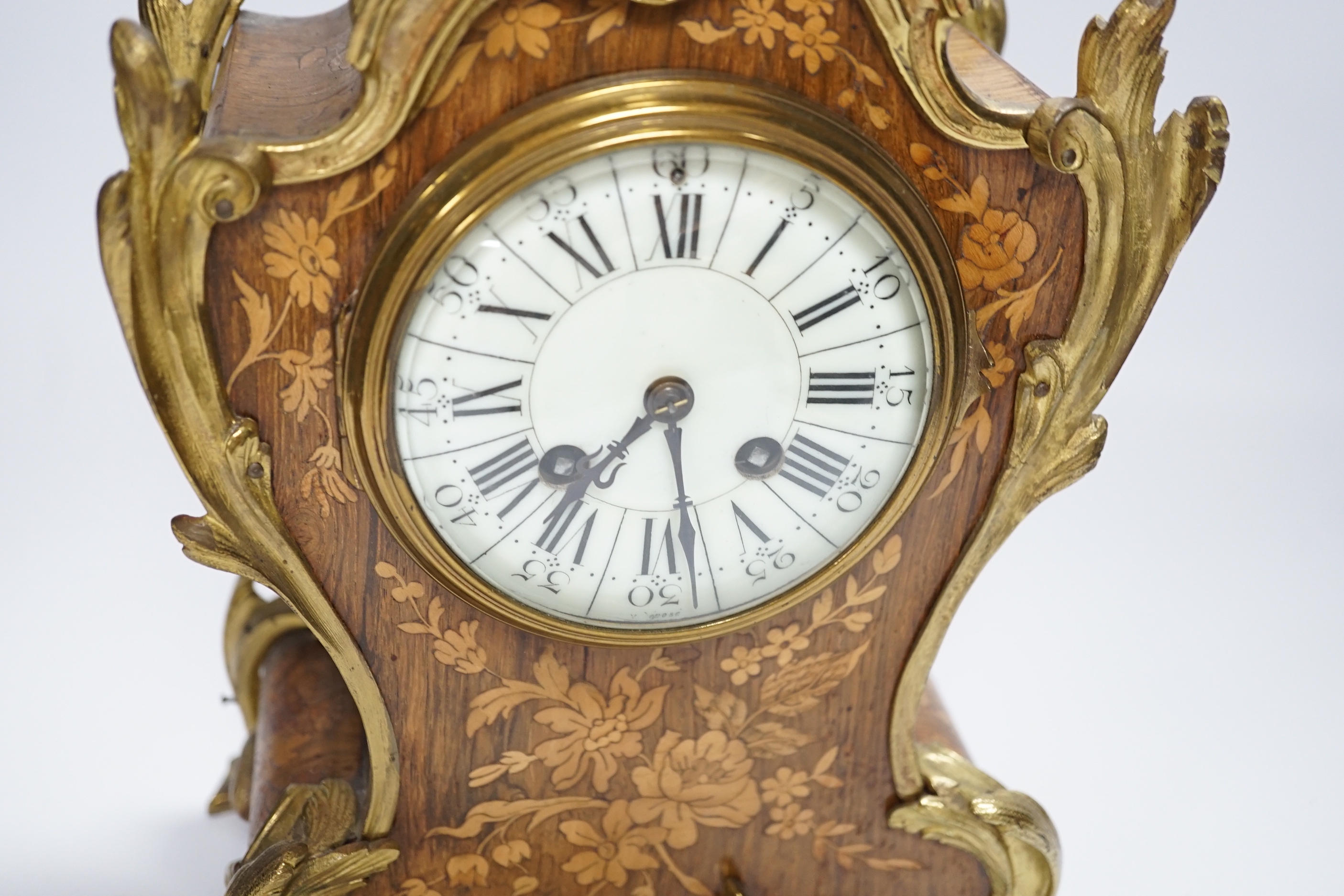 A French gilt metal mounted rosewood and floral marquetry mantel clock. 40cm